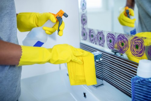 Worker following safe carpet cleaning procedures with protective gear