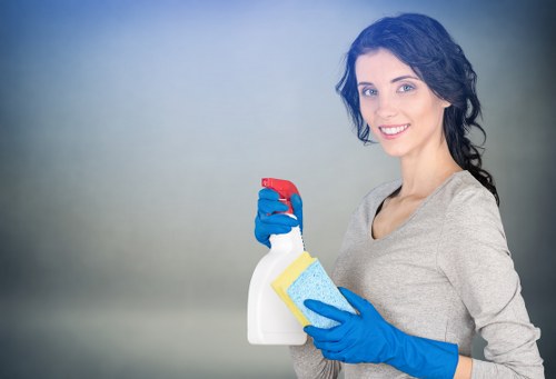 Technician pre-treating carpet stains before steam cleaning